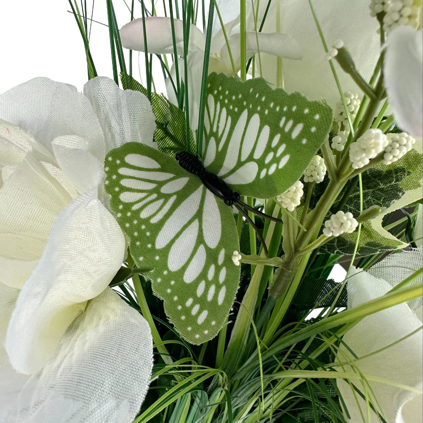 Artificial Grass, White Rose and Wild Flower Arrangement with Butterflies