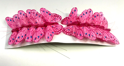 Pink butterfly decorations for flower displays
